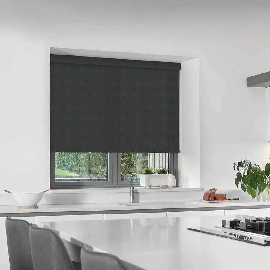 A grey roller blind above a kitchen worktop