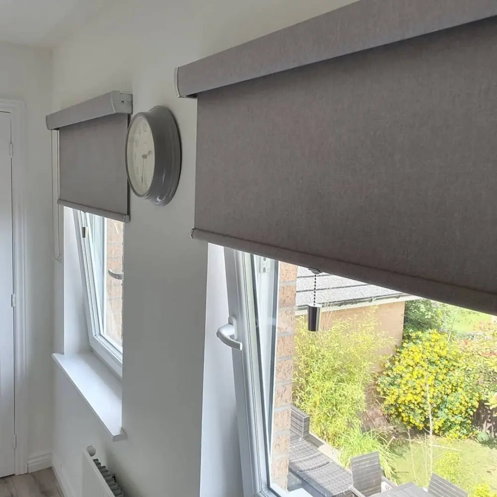 A senses roller blind with a fabric-covered cassette hiding the roll